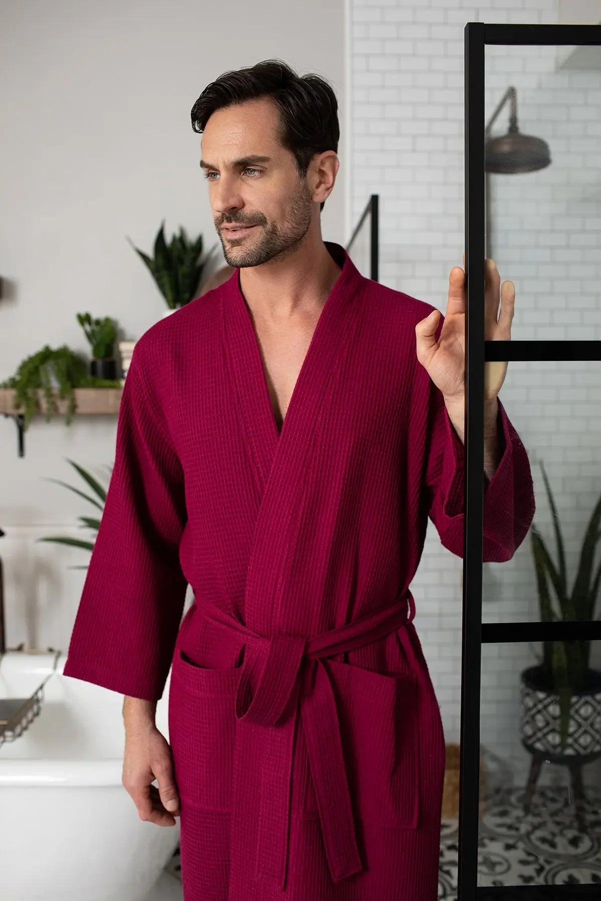 Men's waffle spa bathrobe in wine red, waffle-knit V-neck with belt and 3/4 sleeves.