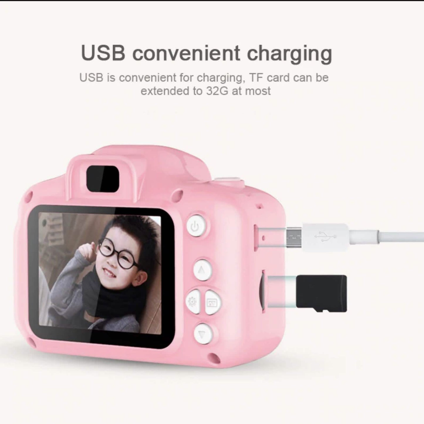Pink mini digital camera with LCD screen and USB cable charging