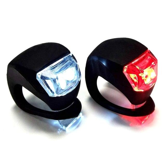 Mini bicycle light set with black silicone mounts, blue front LED and red rear LED