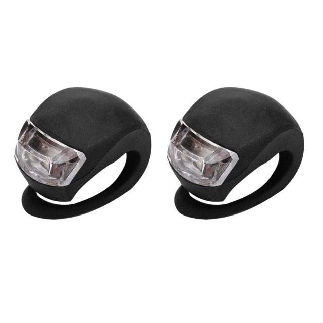 Mini bicycle front and rear lights with black silicone housings and clear LED lenses