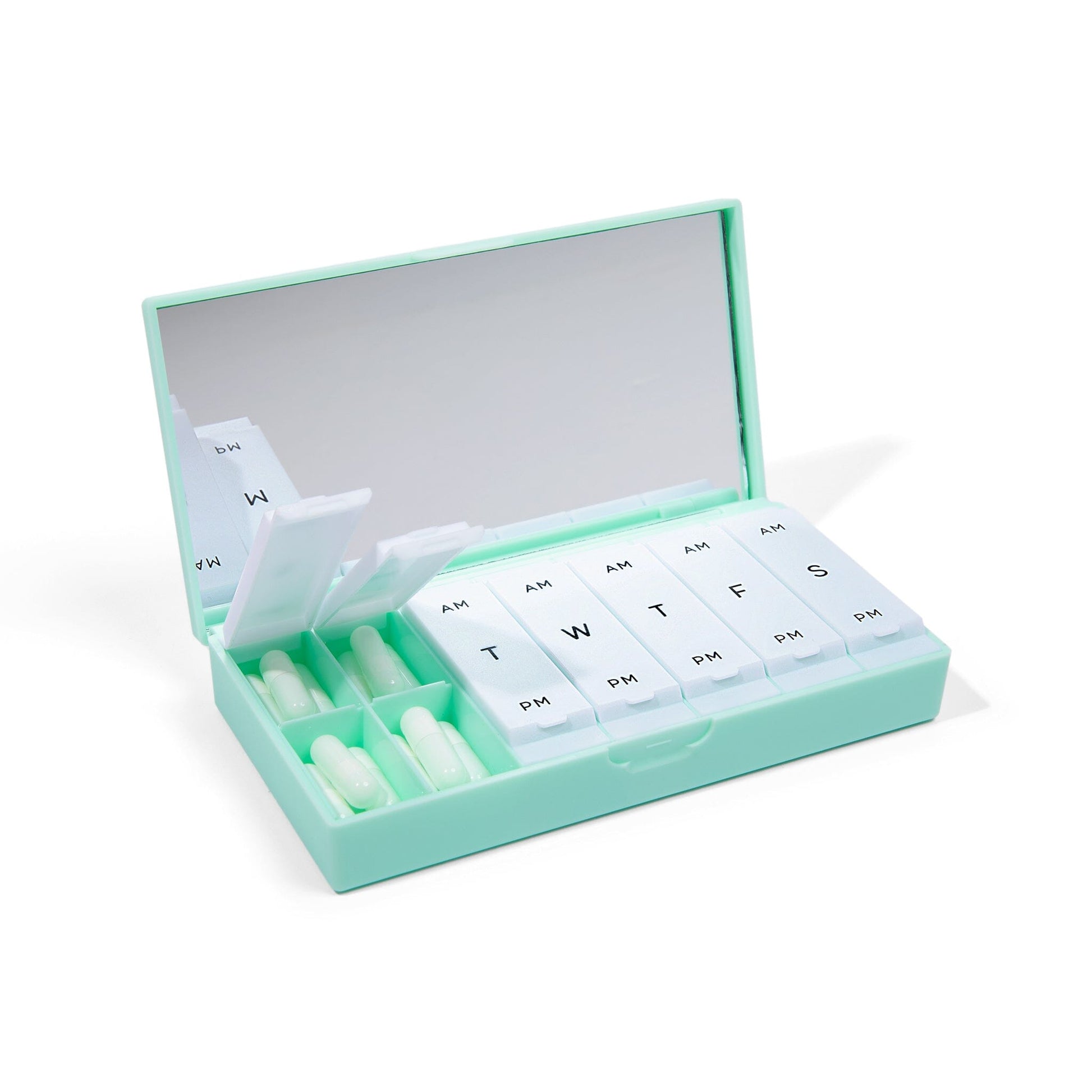 Mint pill box with lift-open lid and labeled AM/PM weekly compartments