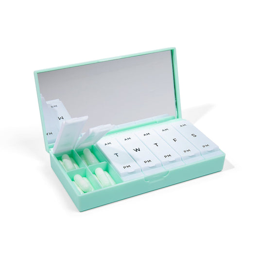 Mint pill box with lift-open lid and labeled AM/PM weekly compartments