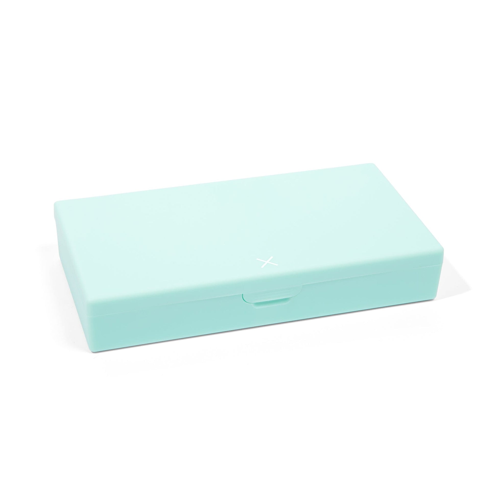 Mint pill organizer case, closed with centered handle and X logo