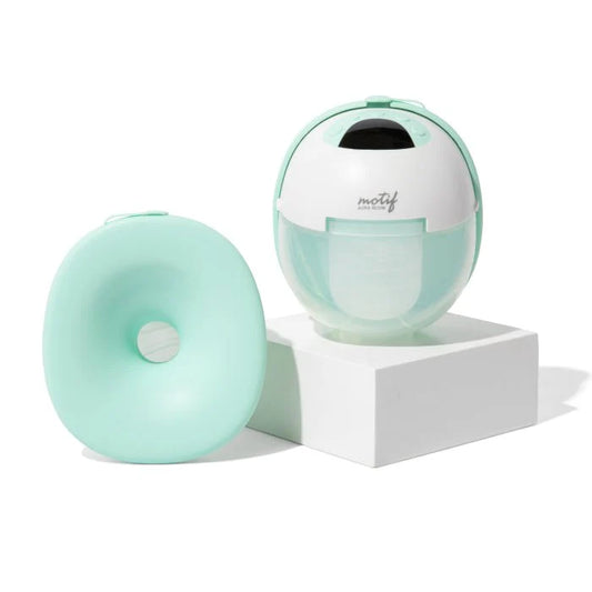 Motif wearable breast pump base with mint collection shield and white pump dome