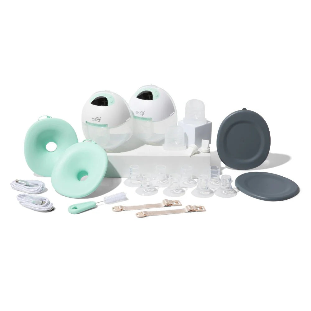 Wearable breast pump kit with mint shields, clear parts, tubes, and dark covers