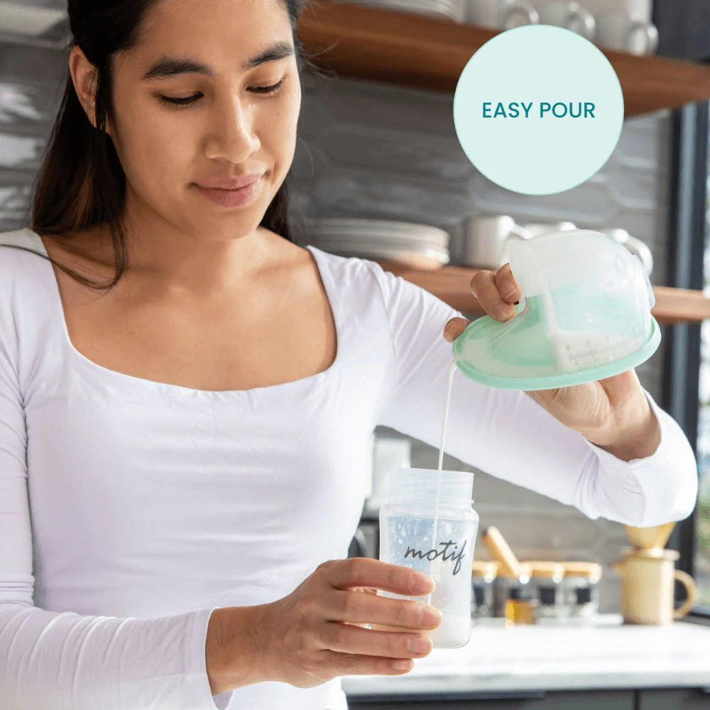 Wearable breast pump collection container being poured with mint reservoir and clear cups