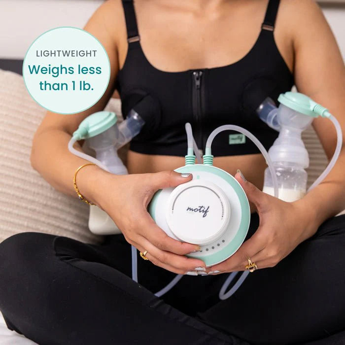 Motif twist double electric breast pump controller held while pumping with two bottles
