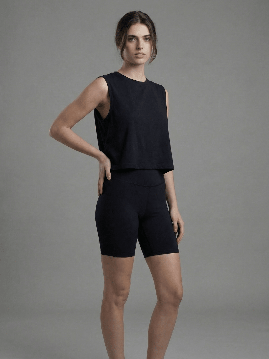 Black muscle tank with crew neck, sleeveless cut and relaxed drape