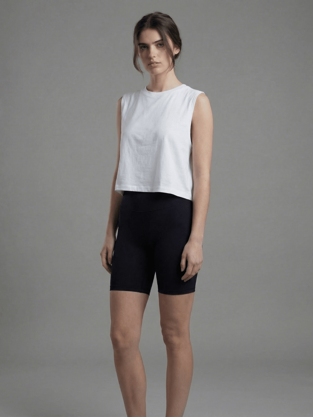 White muscle tank with crew neck and relaxed fit, shown from the front