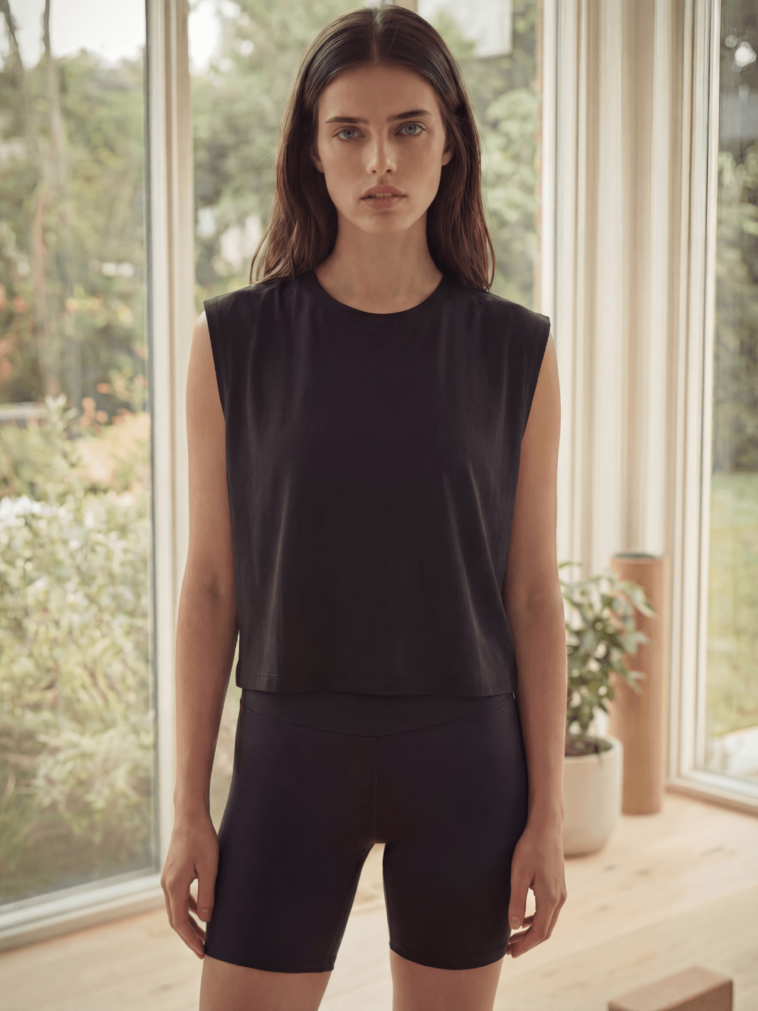 Black muscle tank with round crew neck and sleeveless armholes