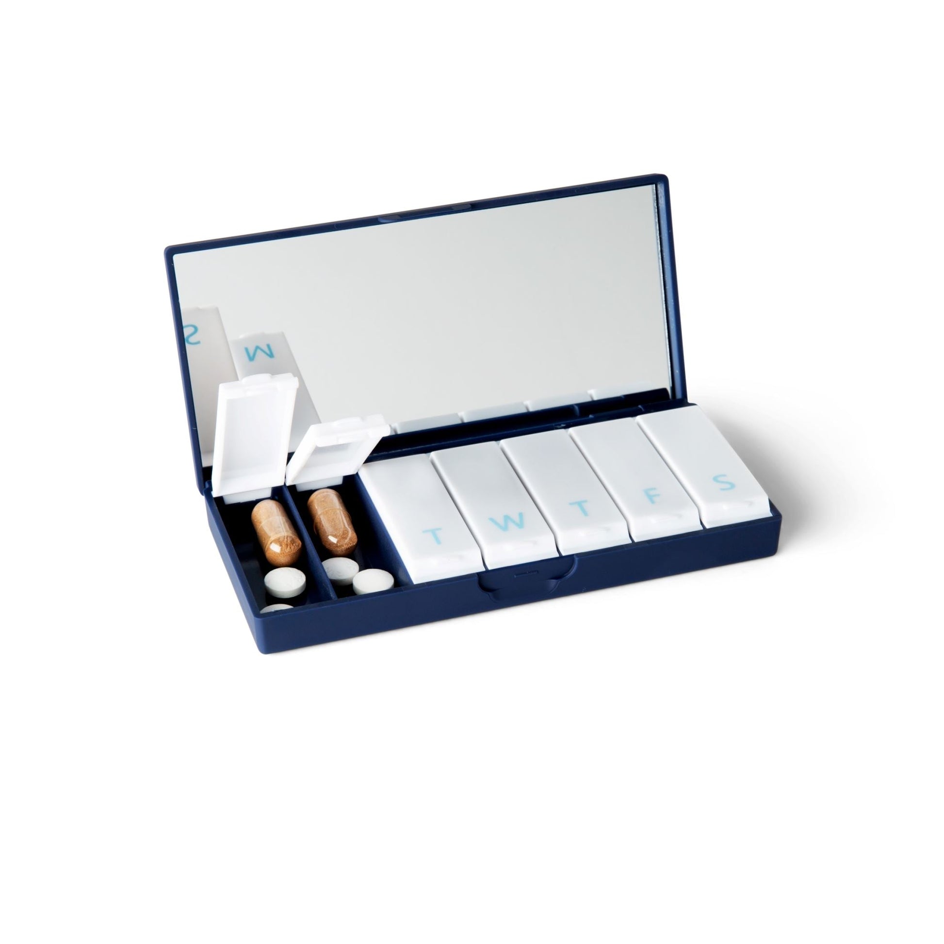 Navy blue pill box with open lid and numbered daily compartments