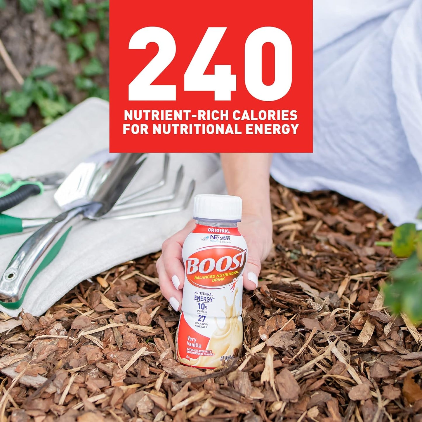 Boost Original very vanilla bottle held in hand, nutritional energy 10g protein