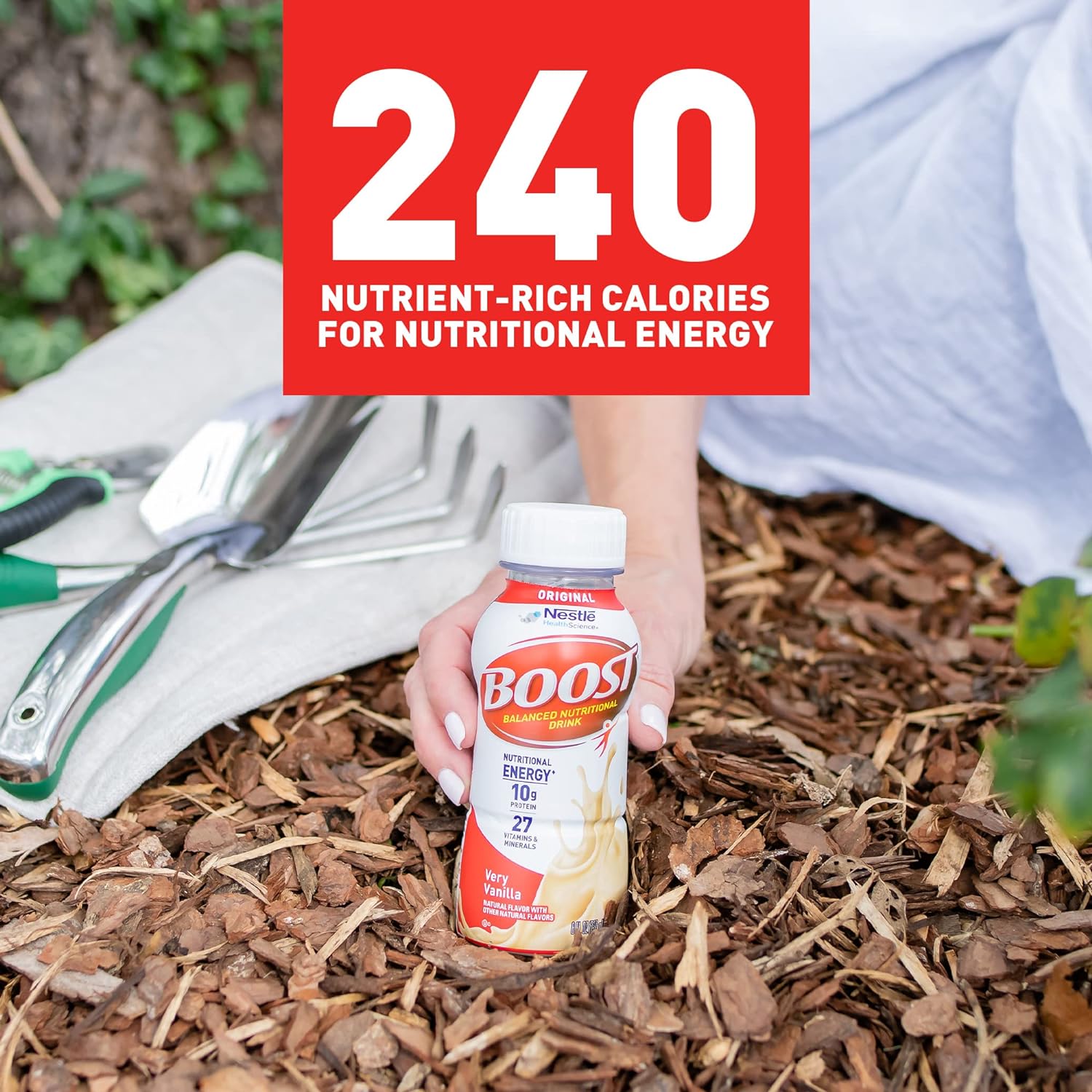 Boost Original very vanilla bottle held in hand, nutritional energy 10g protein