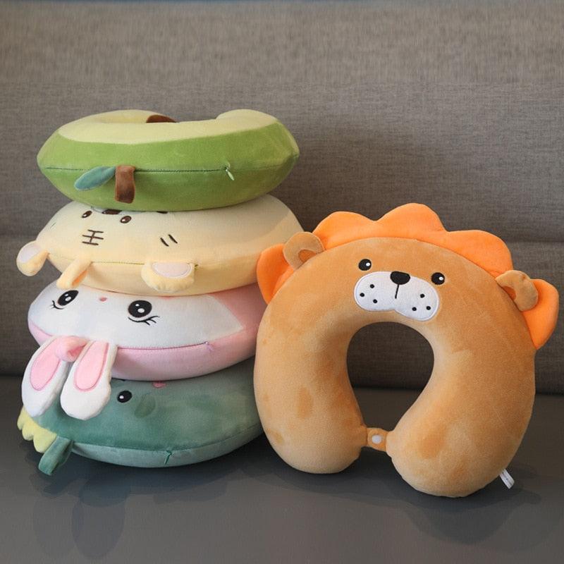Assorted U-shaped animal neck pillows set with lion and bunny designs in warm colors