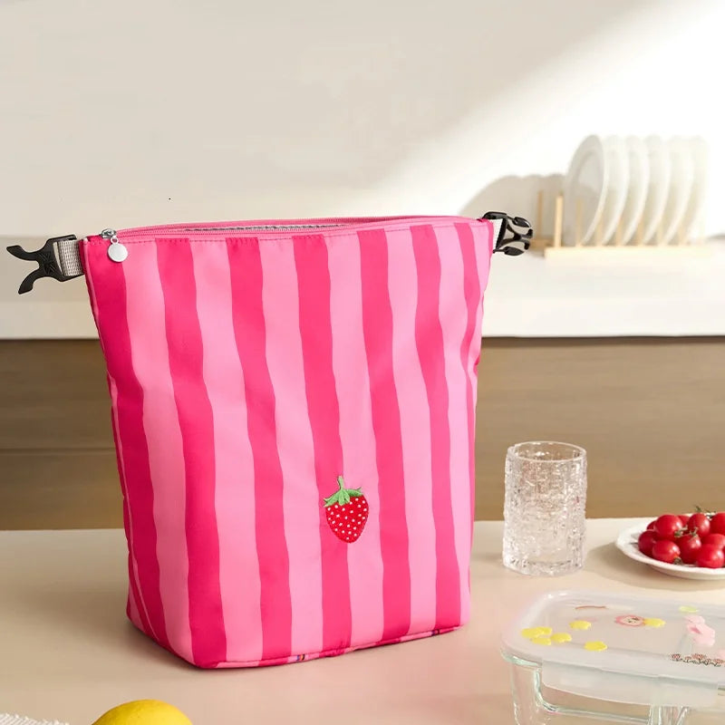 Pink and white striped insulated lunch bag pouch with strawberry patch and black handle