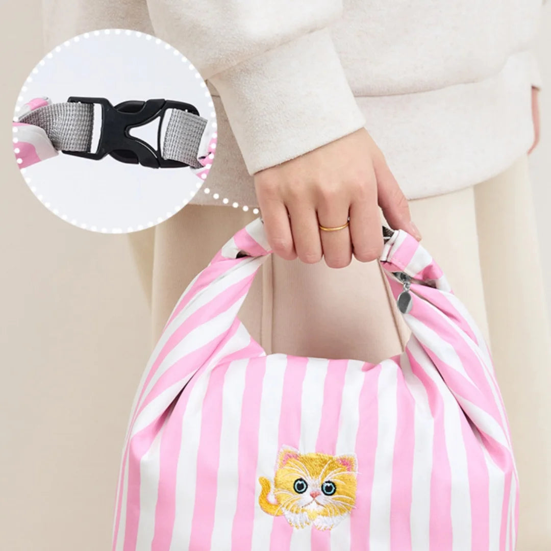 Adjustable strap on pink and white striped insulated lunch bag with cat patch