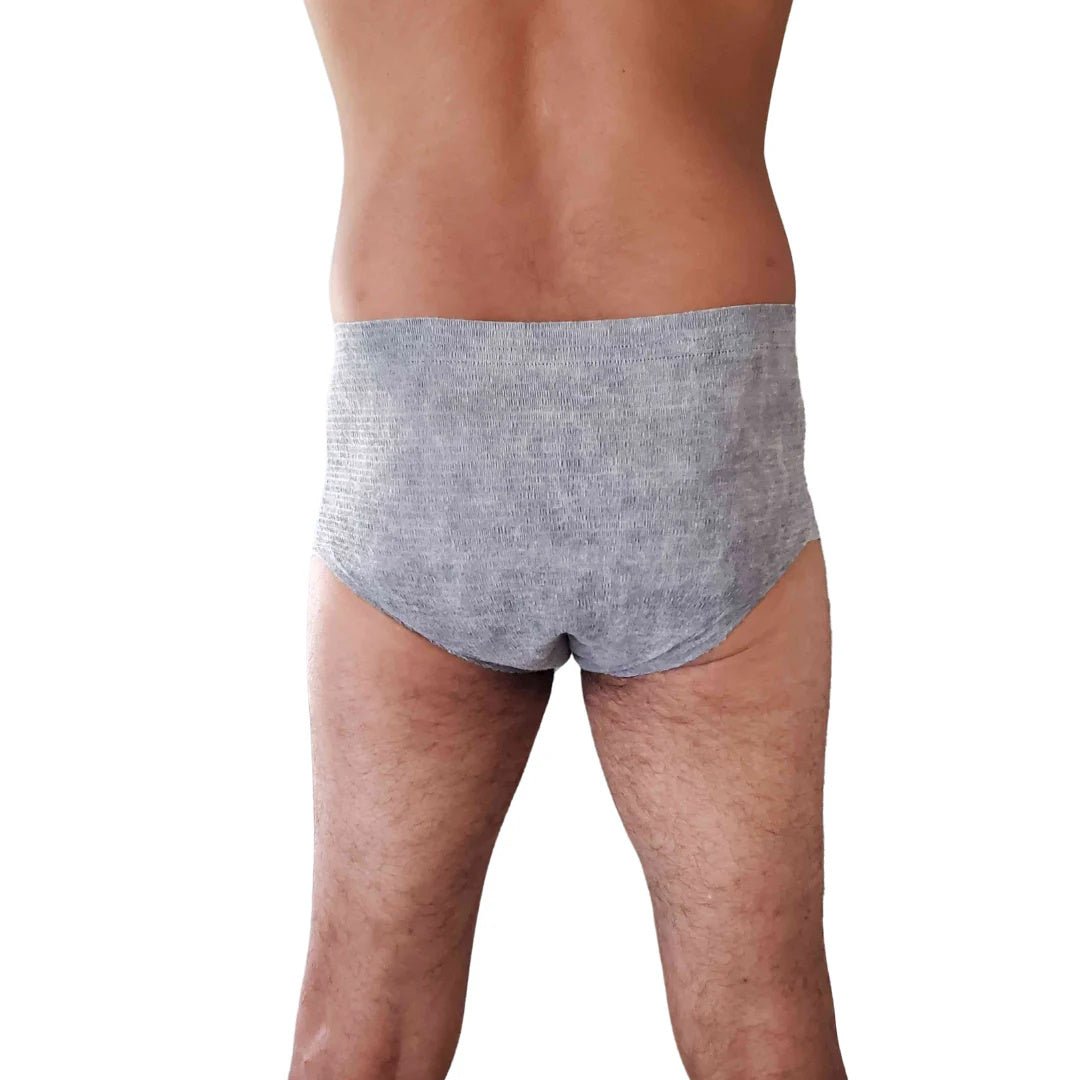 Men’s incontinence underwear, gray knit briefs on model, front view close-up.