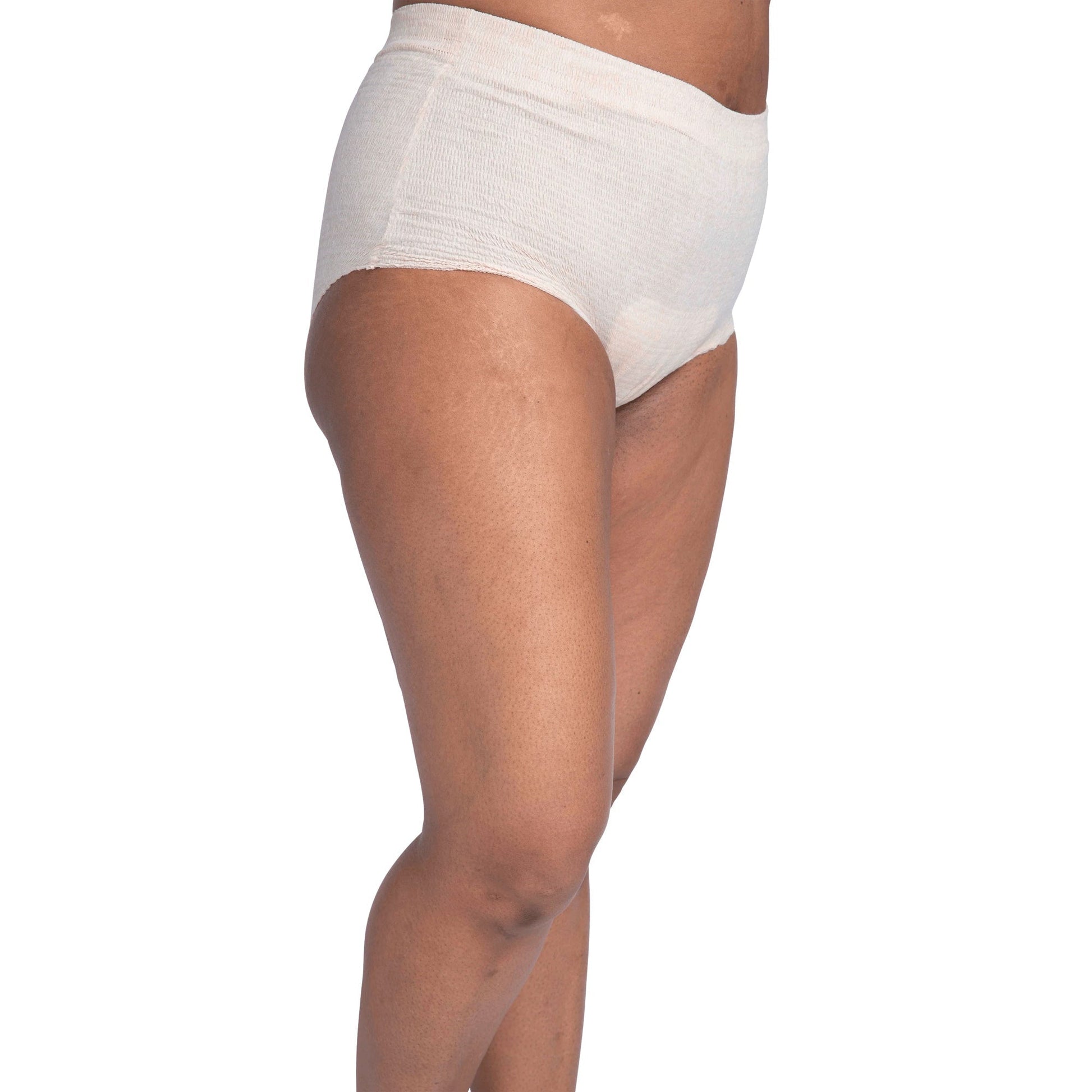 Women's incontinence underwear in light beige, side view showing contoured absorbent panel.