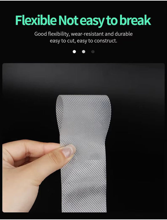 Transparent non-slip tape strip on roll, textured grip surface held in hand