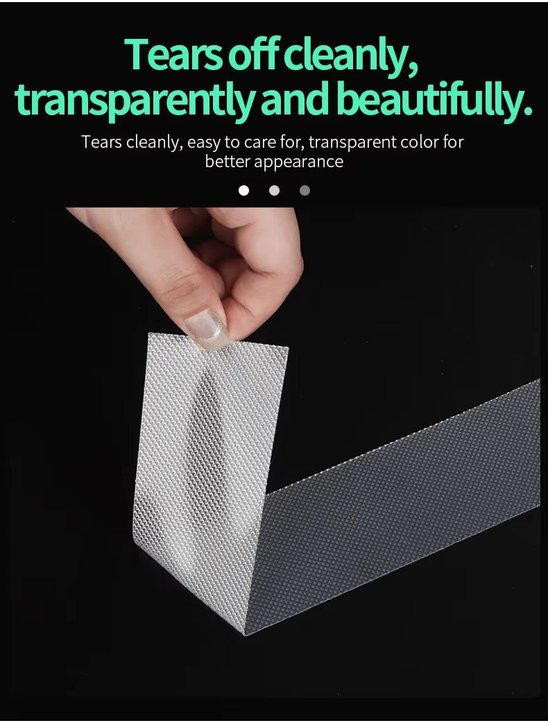 Transparent non-slip tape sheet being torn by hand, textured non-slip surface