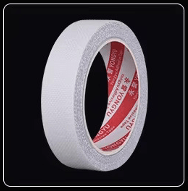 Non-slip grab bar tape roll with white backing, visible red inner core and gray rim