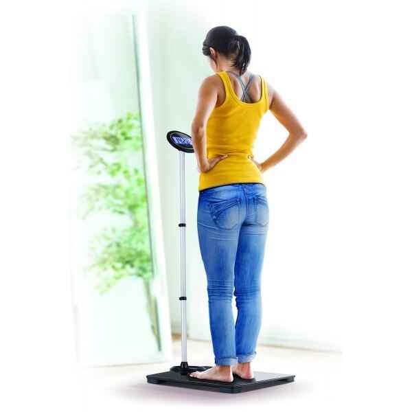 Extra-wide digital scale with round display, side view with person standing