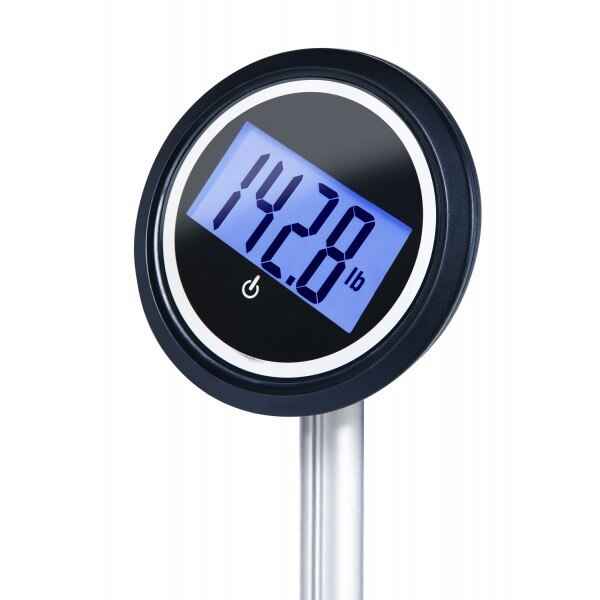 Close-up of circular LCD on digital scale reading 142.8 lb