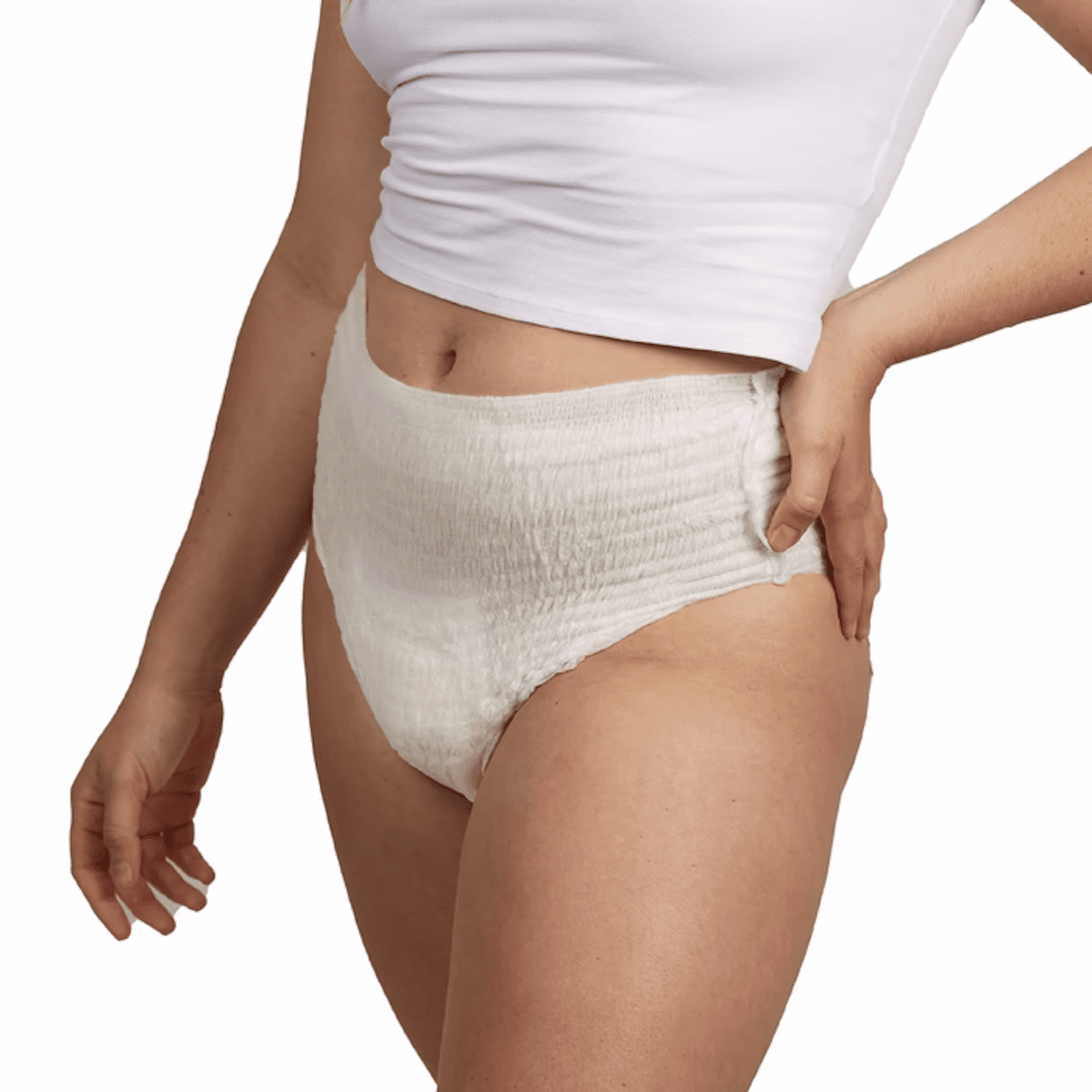 White textured pull-on absorbent underwear on model, front view with hand near waist