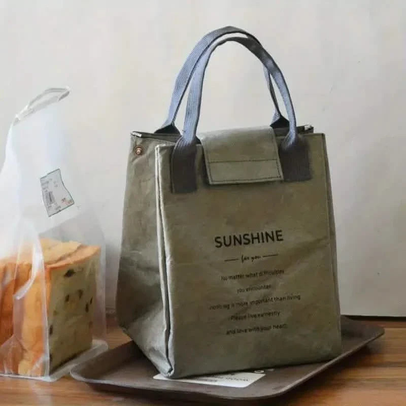 Gray insulated paper bento bag with carry handles and front flap pocket