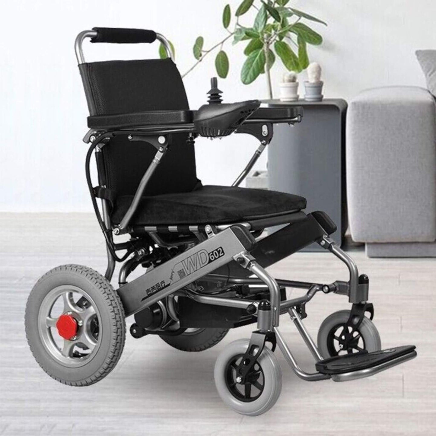 Electric wheelchair in black with armrests and swing-away footrest