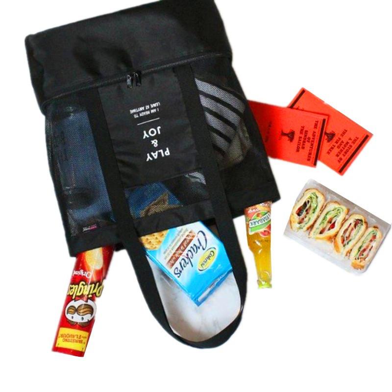 Black insulated cooler bag with front zipper pocket and side accessory storage
