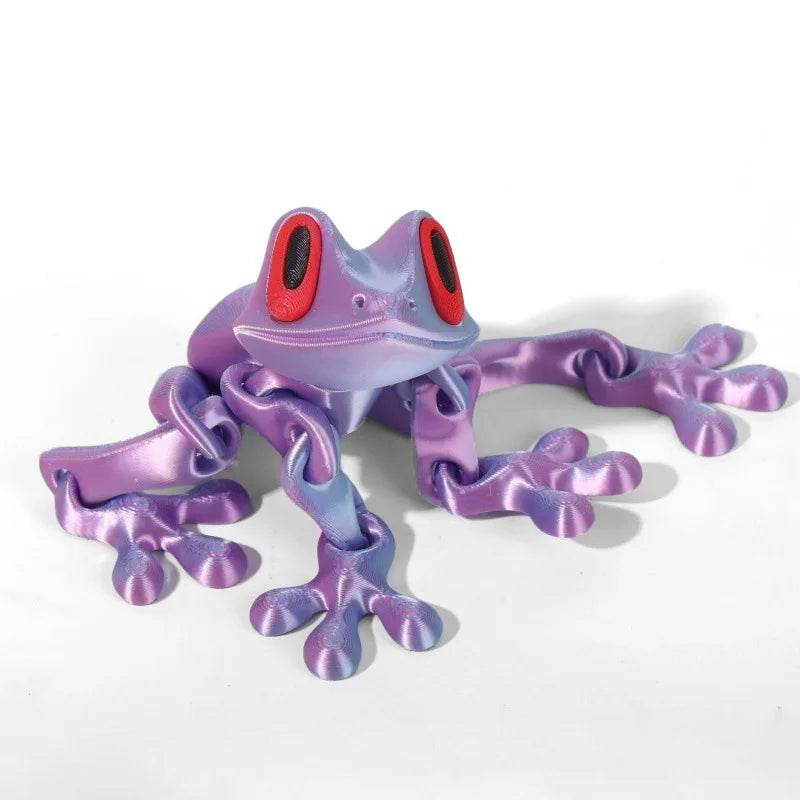 Purple 3D printed magnetic frog toy with red oval eyes and four extended legs.