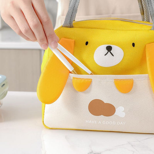 Insulated lunch cooler bag in yellow with cartoon bear face, handled tote style