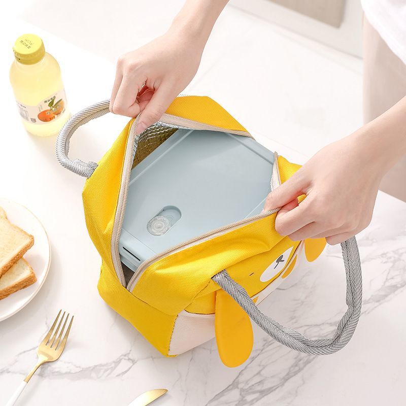 Yellow insulated lunch cooler bag opened to show interior lining and zipper top