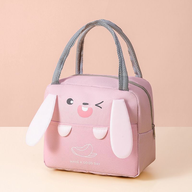 Insulated lunch cooler bag in light pink with cartoon rabbit face and gray handles