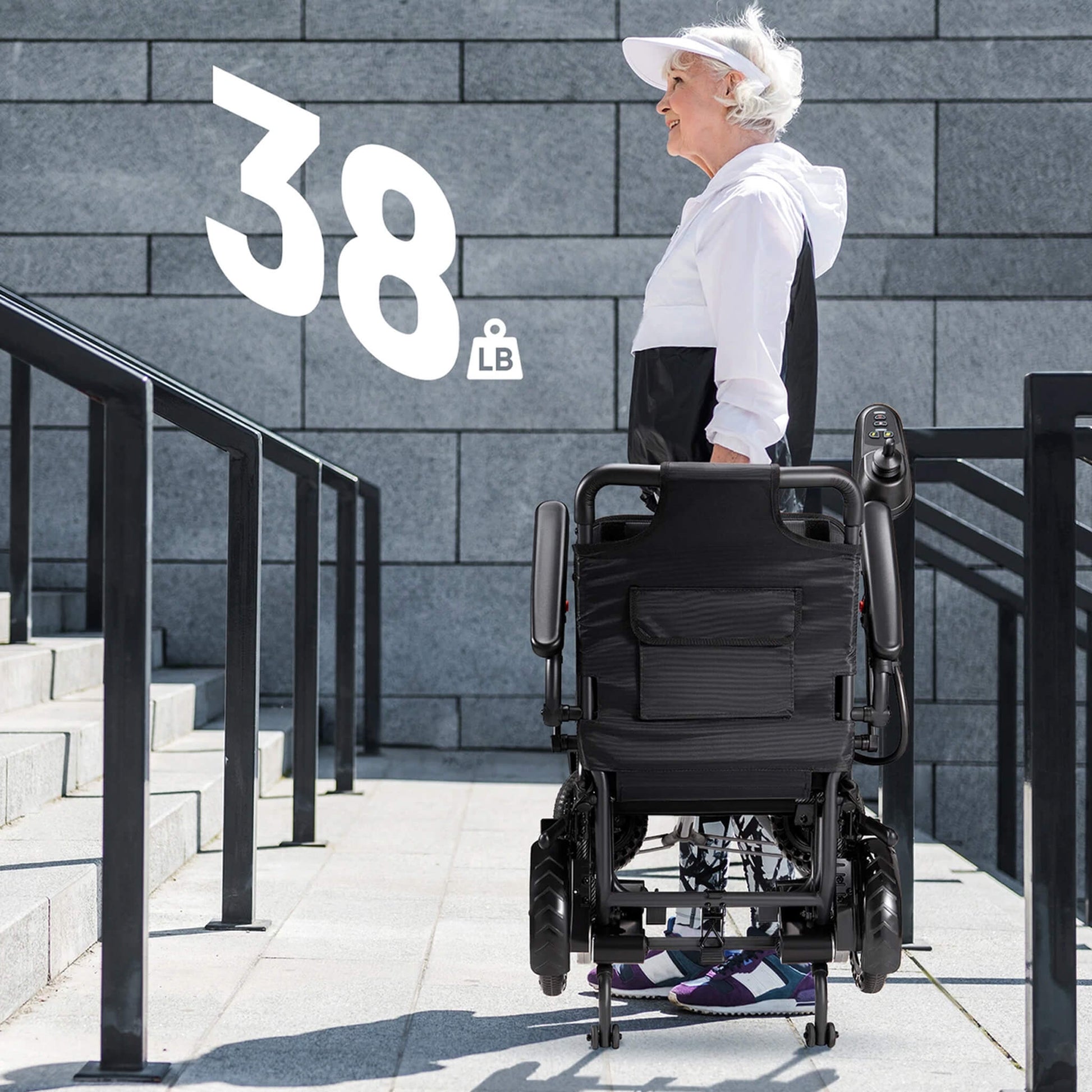 Electric wheelchair viewed from behind with compact folding frame and rear wheels
