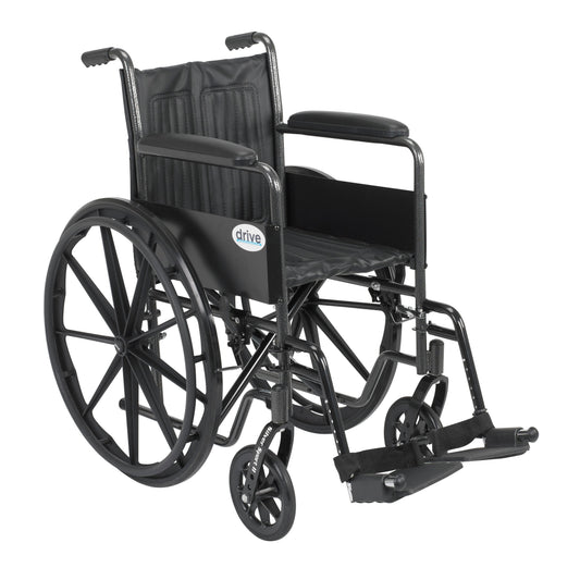 Black wheelchair with silver frame, fixed arms and swing-away footrests, large rear wheels