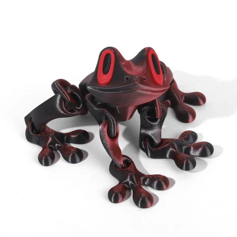 Dark maroon 3D printed magnetic frog toy with red oval eyes and four extended legs.
