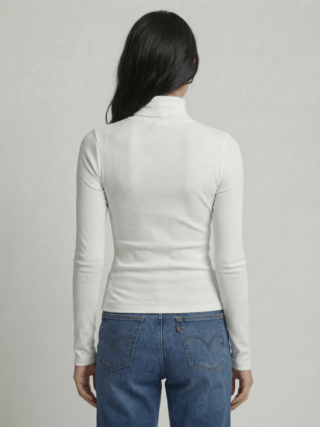 White ribbed turtleneck sweater, back view, high neck, long fitted sleeves