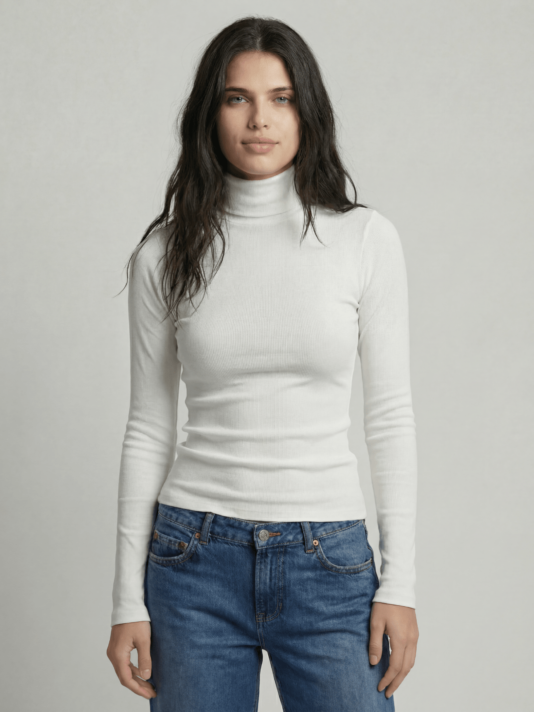 White ribbed turtleneck sweater with high neck and long fitted sleeves