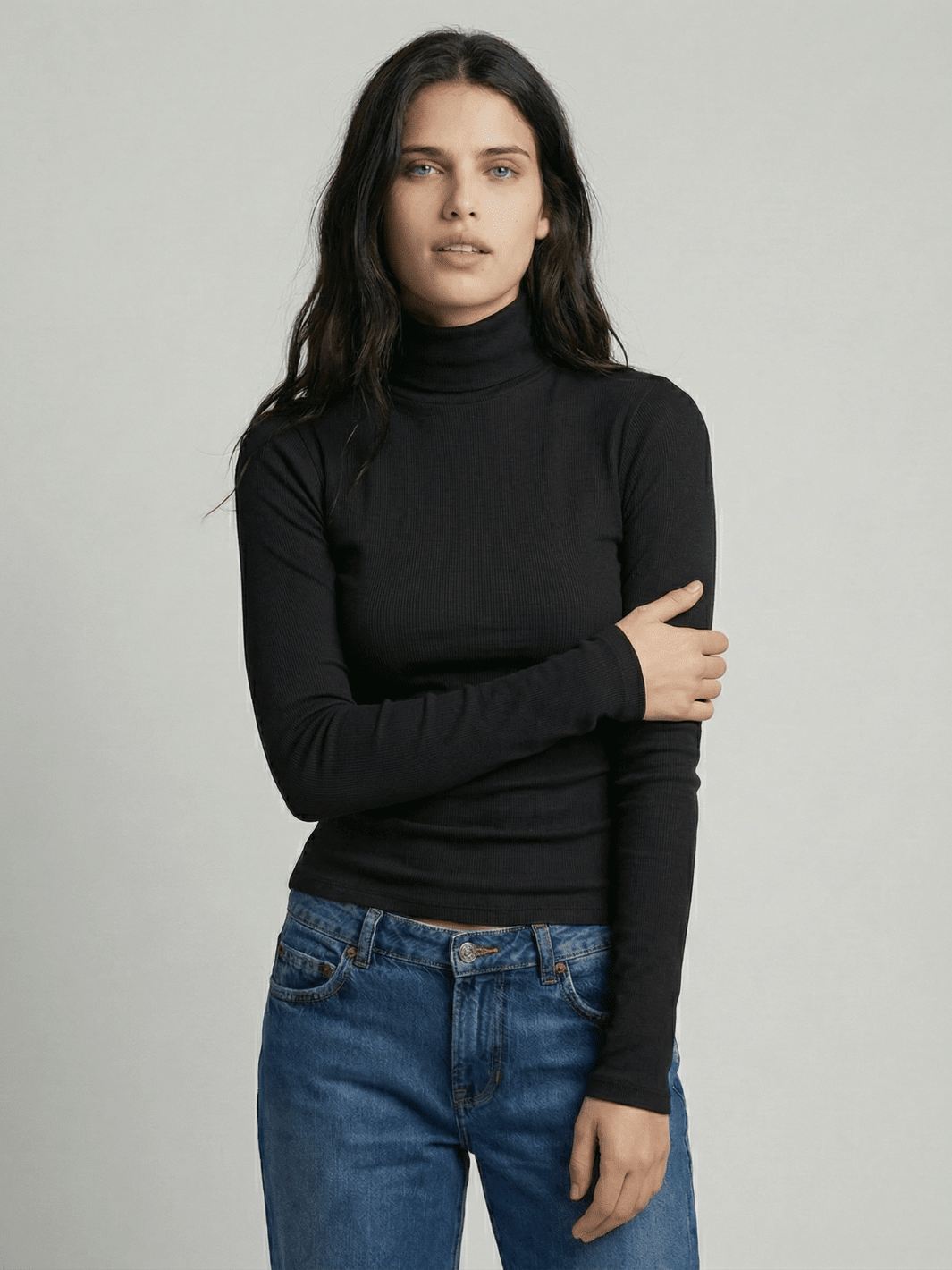 Black ribbed turtleneck sweater with high neck and long fitted sleeves
