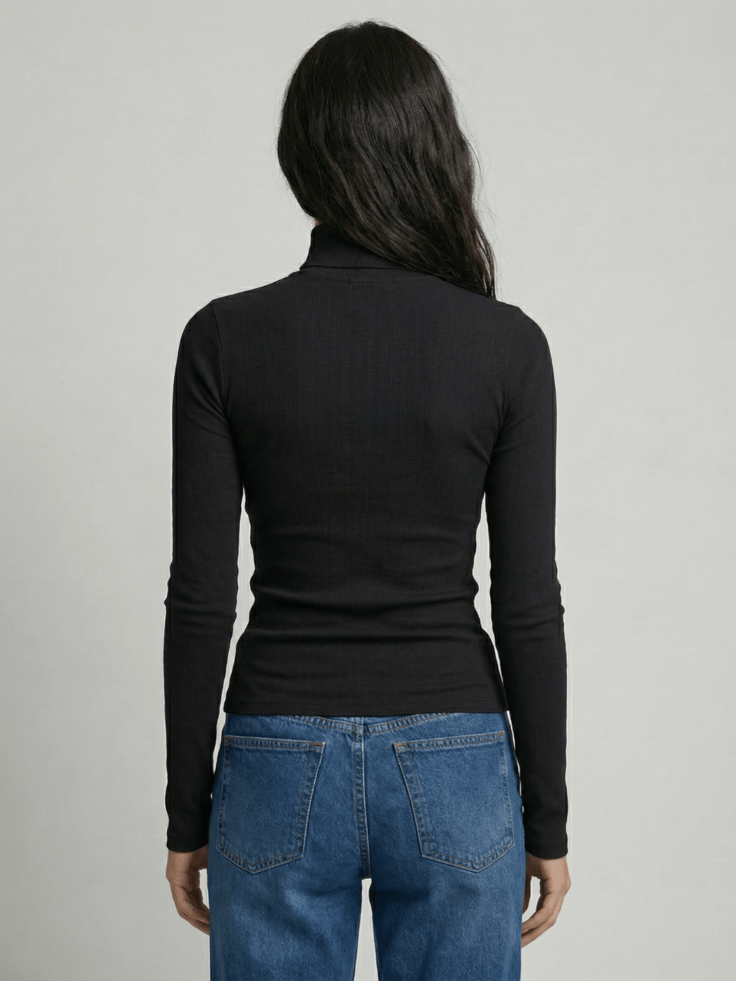 Black ribbed turtleneck sweater, back view, long sleeves, fitted knit