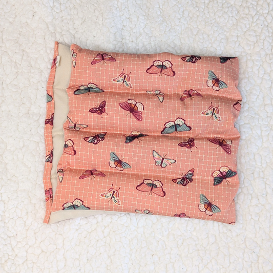 Weighted heating pad with fluttering lattice butterfly print, coral flannel cover