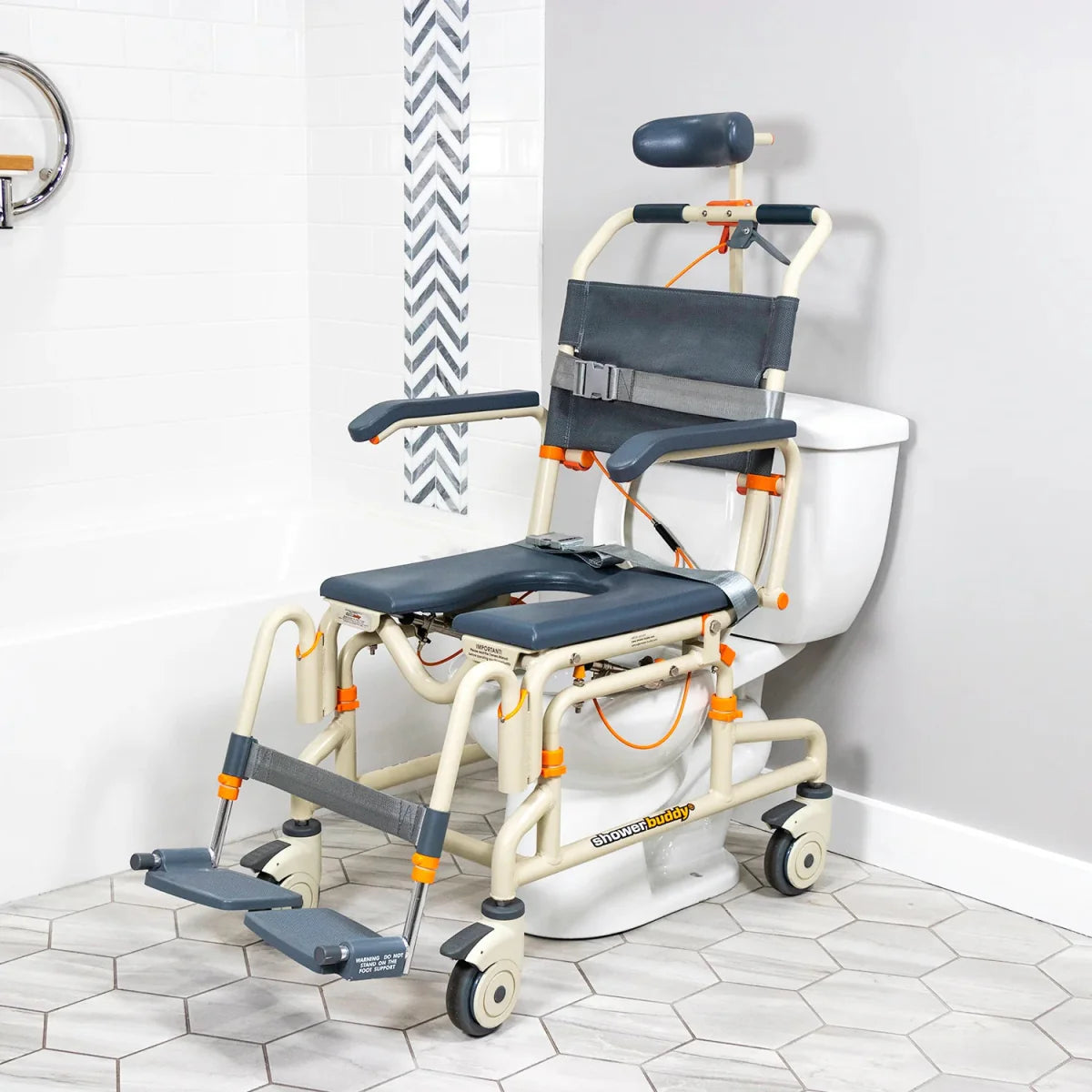 Shower chair with tilt over toilet, dark blue seat and back, safety straps