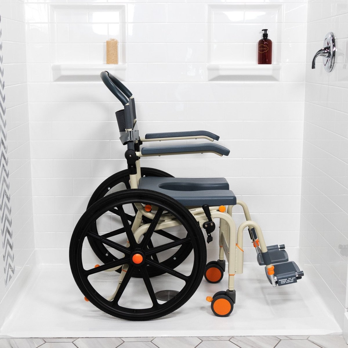 Shower wheelchair side view with dark blue seat pan, padded back, and large rear wheel
