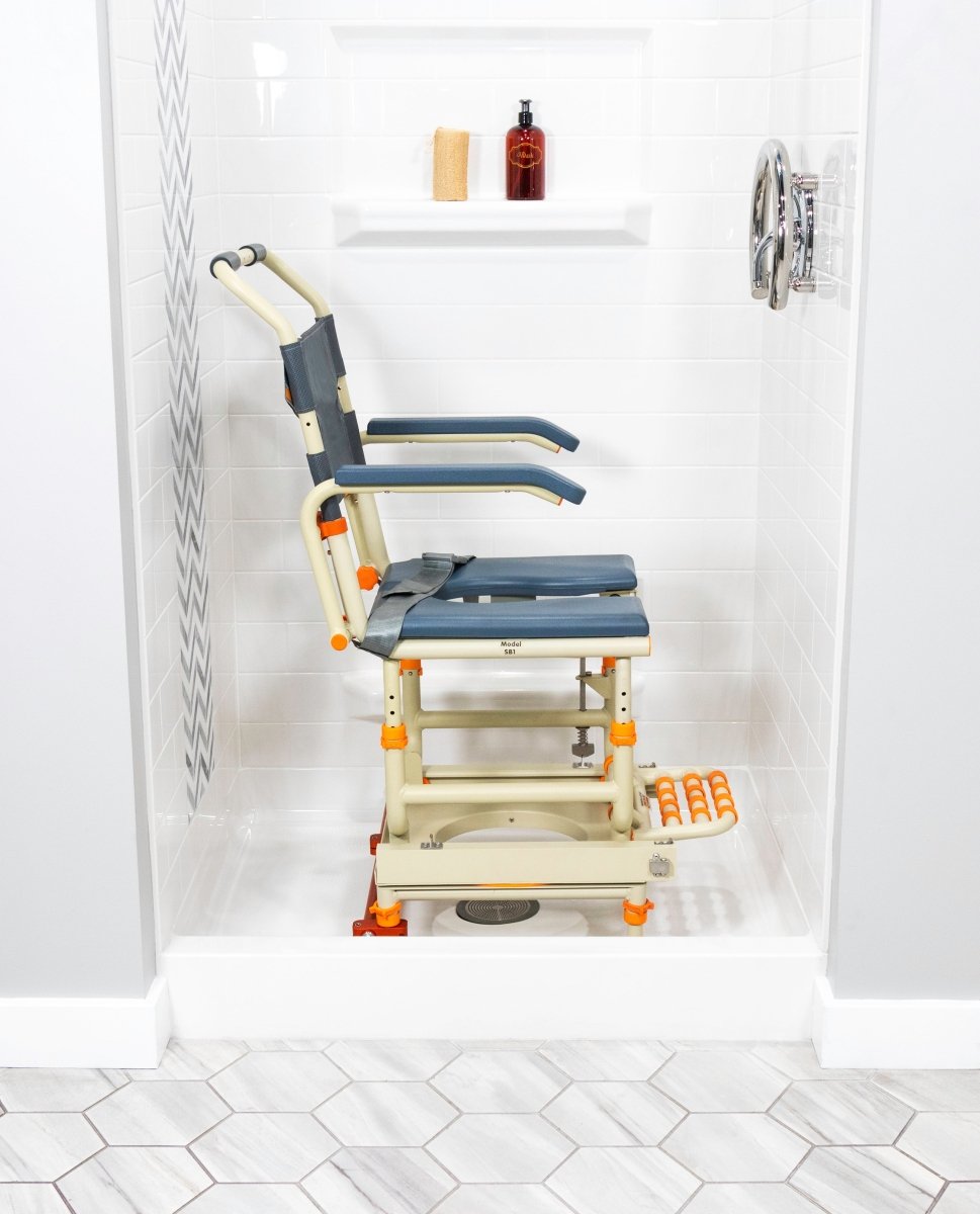 Accessible shower chair with blue padded seat, armrests, and safety handles