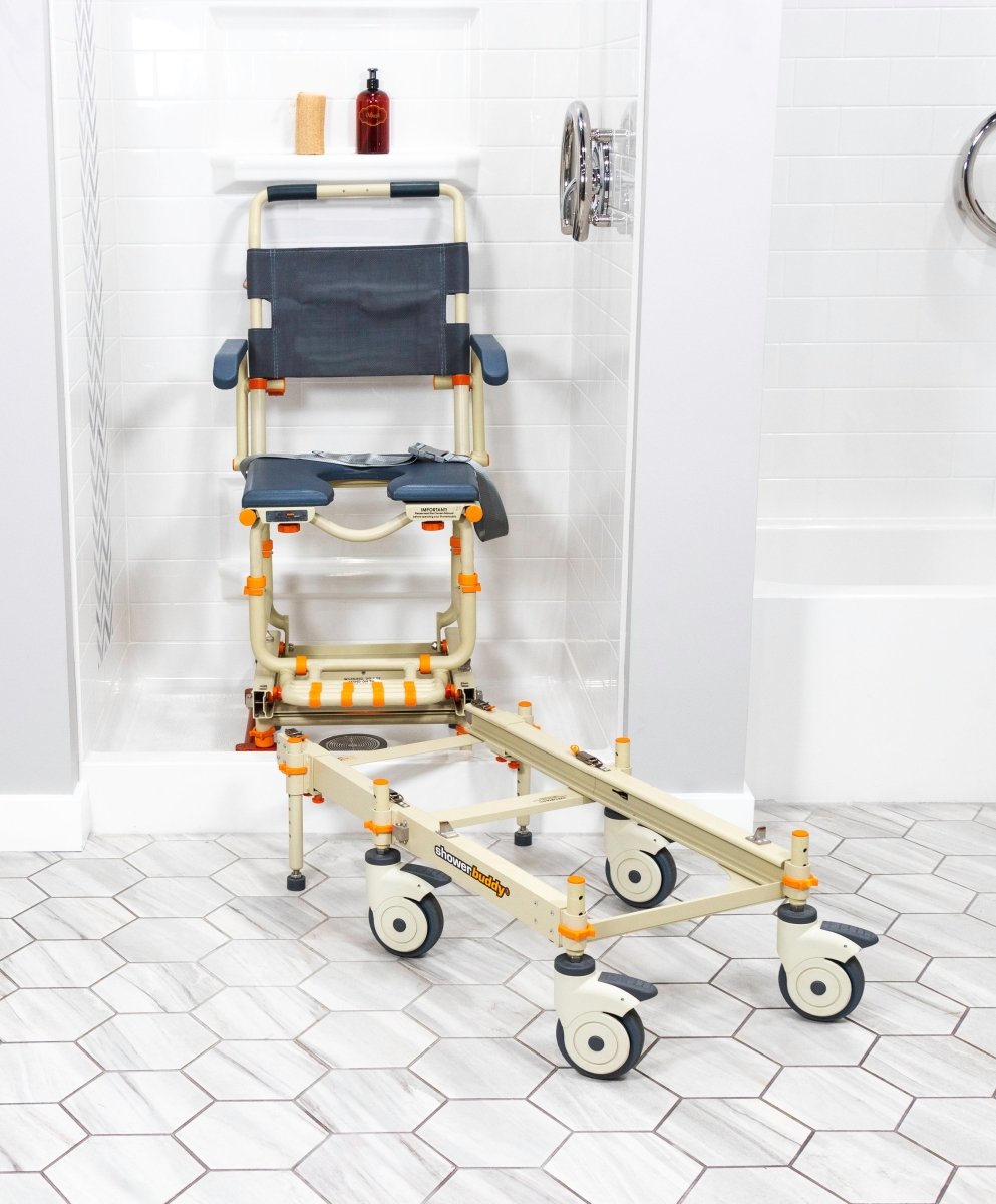 Shower chair with navy padded seat and back, white frame, orange legs, wheels