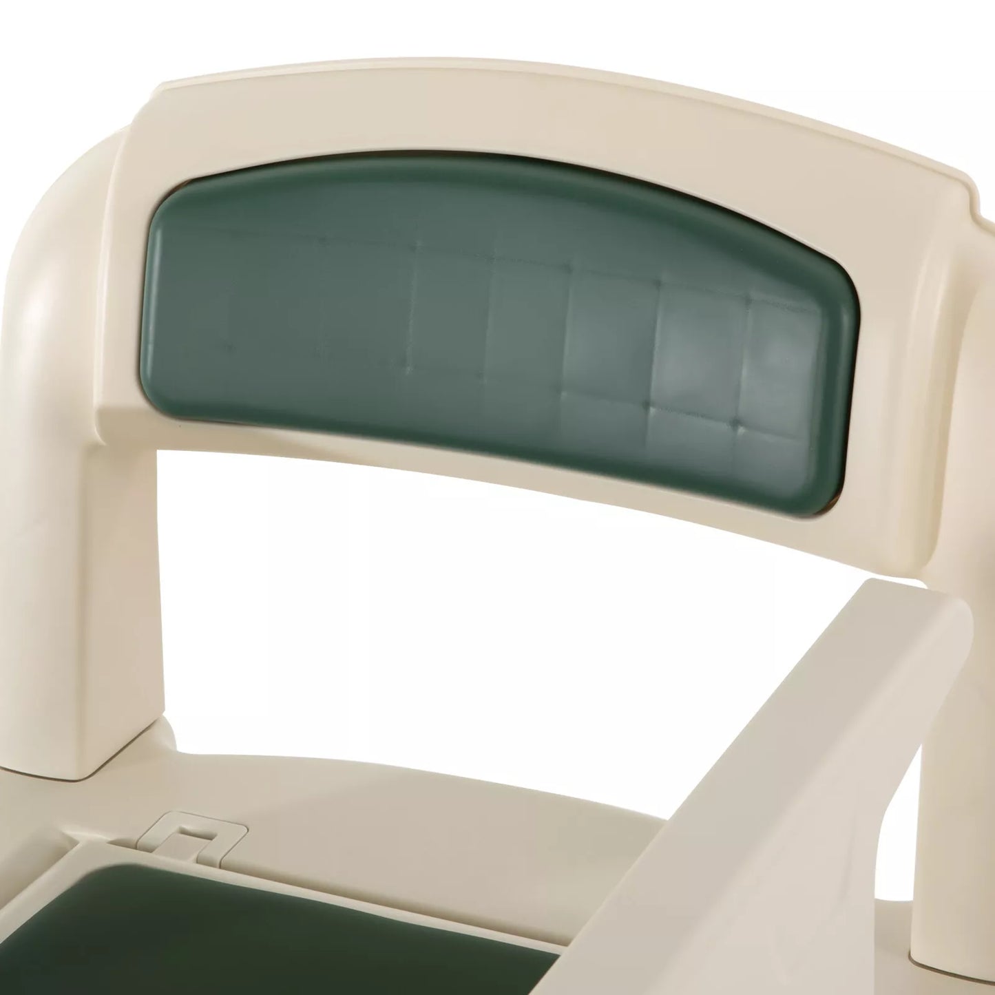 Close-up of green padded backrest on white adult bedside commode chair with arm supports