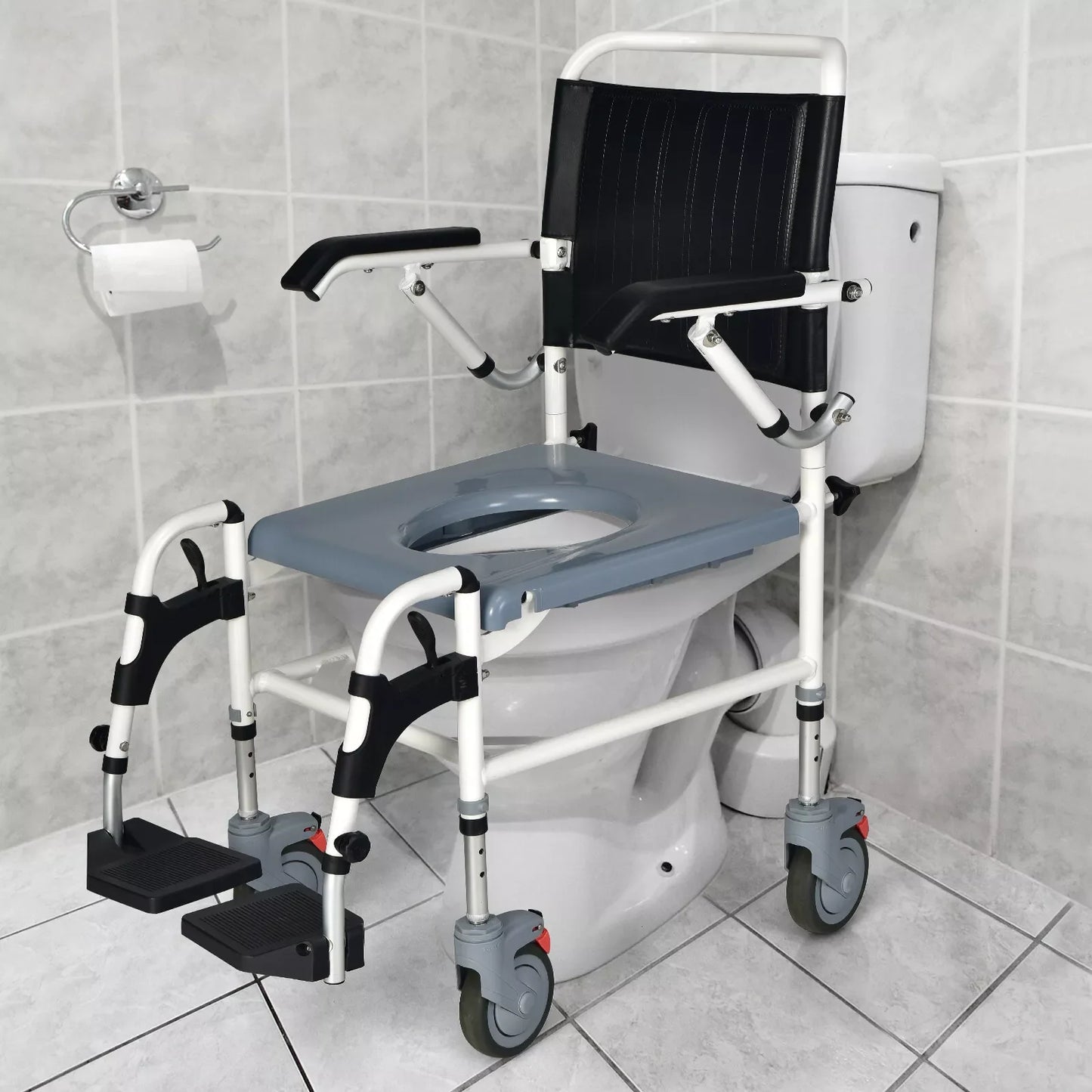 Shower wheelchair with black padded back and seat, white frame, and swing-up armrests
