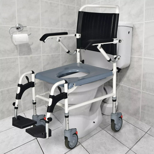Shower wheelchair with black padded back and seat, white frame, and swing-up armrests